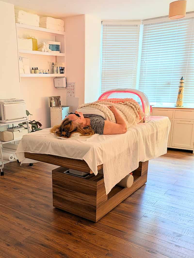 A woman lying on a massage table